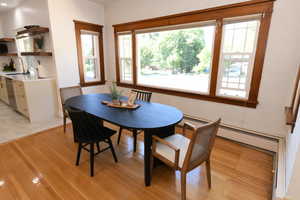 Dining area with light wood-type flooring