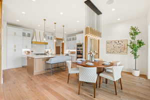 Dining area featuring recessed lighting and light wood finished floors