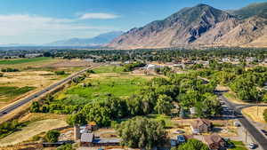 Aerial view of property and surrounding area with mountains