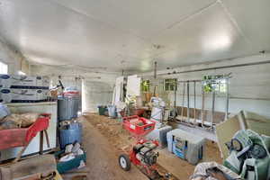 Misc room with healthy amount of natural light and unfinished concrete floors