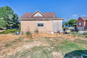 View of home's exterior featuring brick siding and a central air condition unit
