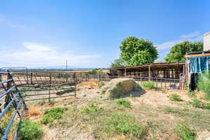 View of yard with an exterior structure, an outbuilding, and a view of countryside