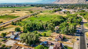 Aerial view of property's location with a mountain backdrop