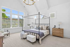 Bedroom with a chandelier, carpet, high vaulted ceiling, a mountain view, and beamed ceiling