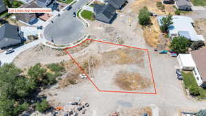 Aerial view of property and surrounding area with property parcel outlined