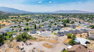 Aerial perspective of suburban area featuring a mountain backdrop