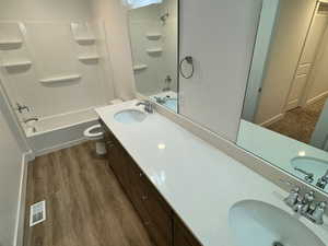 Full bathroom with a shower and vanity