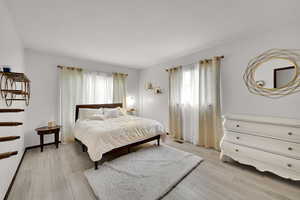 Bedroom with light wood finished floors