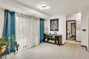 Spare room with washing machine and dryer and wood finished floors