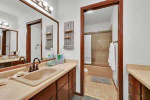 Full bathroom featuring vanity and shower / tub combination