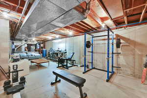 Exercise room featuring water heater