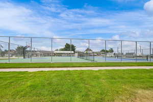 View of tennis court featuring community basketball court