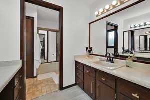 Full bath featuring vanity and bathing tub / shower combination