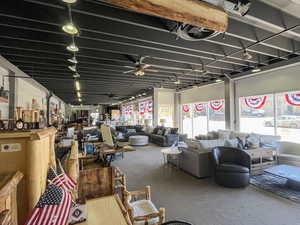 Miscellaneous room with carpet floors and ceiling fan