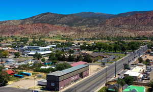 Aerial view of residential area with a mountainous background