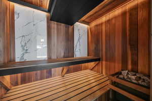 Relaxing sauna featuring wood walls