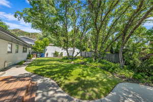 Fenced backyard with a wooden deck