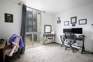 Office with carpet flooring and baseboards