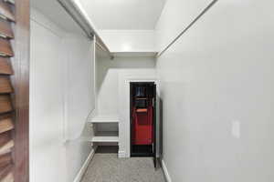 Walk in closet with carpet flooring