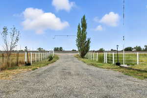 View of dirt / gravel road featuring a view of countryside