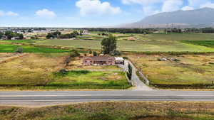 Aerial view of sparsely populated area featuring a mountainous background