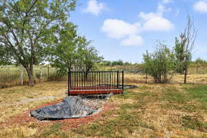 View of yard featuring a wooden deck