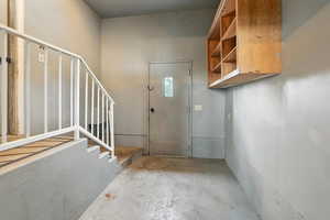 Foyer featuring concrete floors