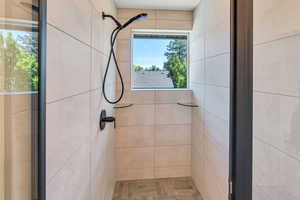 Full bath with a shower stall
