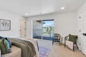 Bedroom featuring light colored carpet, access to outside, and recessed lighting