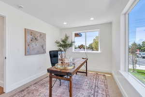 Office featuring light colored carpet and recessed lighting