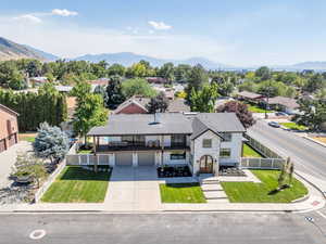 Aerial view of residential area featuring a mountainous background