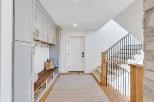 Mudroom with light wood-style flooring and recessed lighting