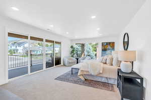 Carpeted bedroom featuring access to exterior and recessed lighting