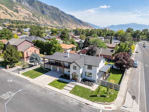 Aerial perspective of suburban area featuring a mountain backdrop