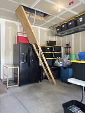 Garage with black fridge
