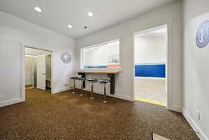 Home office with baseboards and recessed lighting