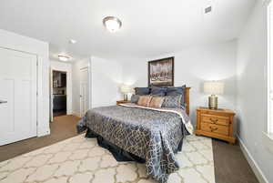 Bedroom with carpet floors and a closet