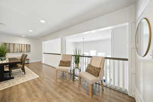 Living area with recessed lighting and wood finished floors