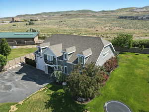 View from above of property with a mountain backdrop