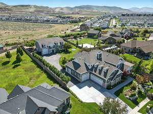Aerial perspective of suburban area with a mountainous background