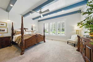 Carpeted bedroom featuring beamed ceiling, a ceiling fan, and recessed lighting