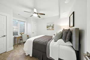 Bedroom featuring light carpet and a ceiling fan
