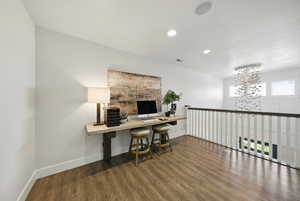 Home office with wood finished floors, a chandelier, and recessed lighting
