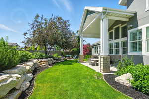 Fenced backyard featuring a patio