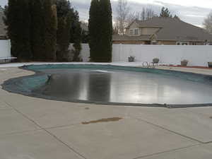 View of swimming pool with a patio area