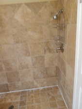 Bathroom with a tile shower