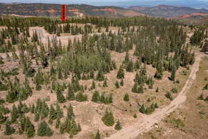 Aerial view of property and surrounding area with mountains