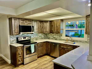 Kitchen with New Countertop, Dishwasher and Flooring