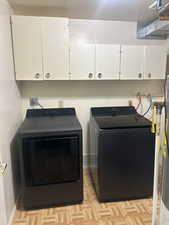 Laundry with cabinet space and independent washer and dryer