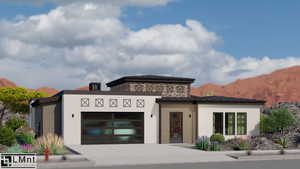Contemporary house with a standing seam roof, a garage, driveway, a metal roof, and a mountain view